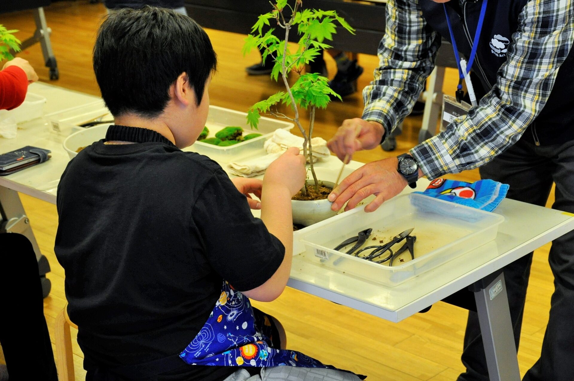 Assisting in a workshop aimed at children.